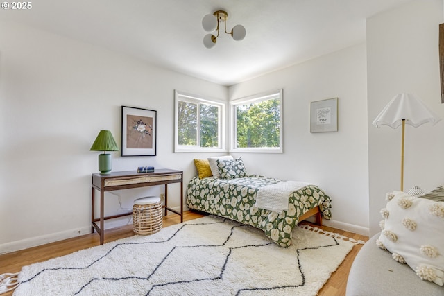 6220 SW 45th Ave, Portland, OR 97221 - bedroom featuring baseboards and wood finished floors