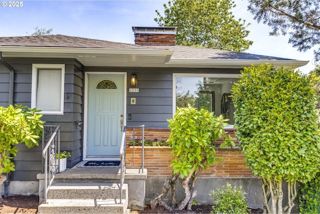 6220 SW 45th Ave, Portland, OR 97221 - property entrance with a chimney and a shingled roof