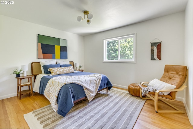 6220 SW 45th Ave, Portland, OR 97221 - bedroom featuring light wood-type flooring and baseboards