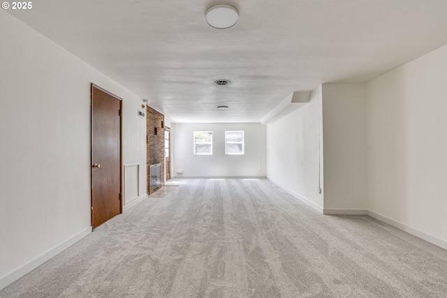 6220 SW 45th Ave, Portland, OR 97221 - unfurnished living room featuring carpet, baseboards, and a fireplace