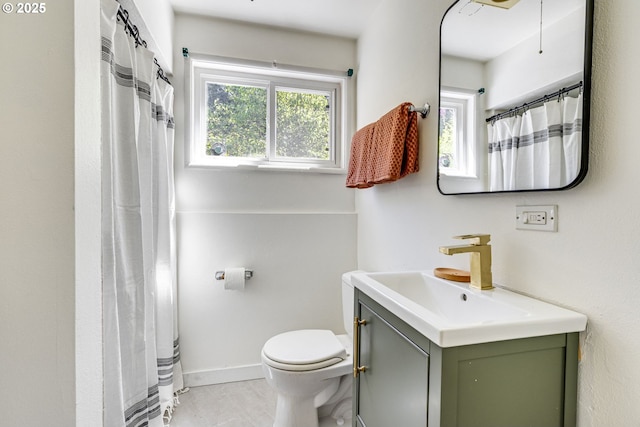 6220 SW 45th Ave, Portland, OR 97221 - full bath with plenty of natural light, vanity, toilet, and baseboards