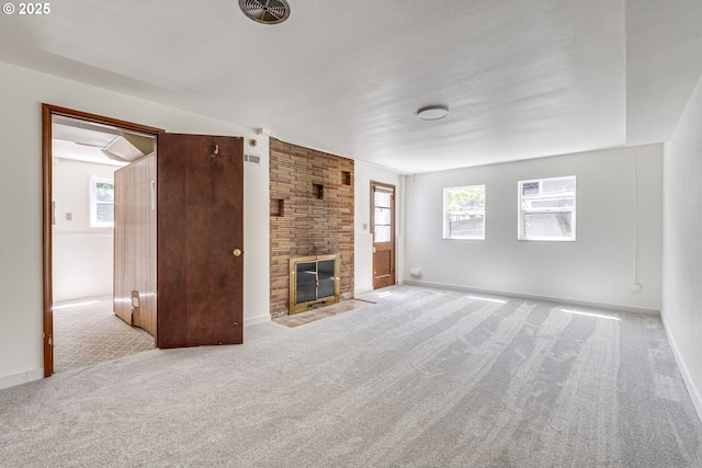 6220 SW 45th Ave, Portland, OR 97221 - unfurnished living room featuring carpet, a fireplace, and baseboards