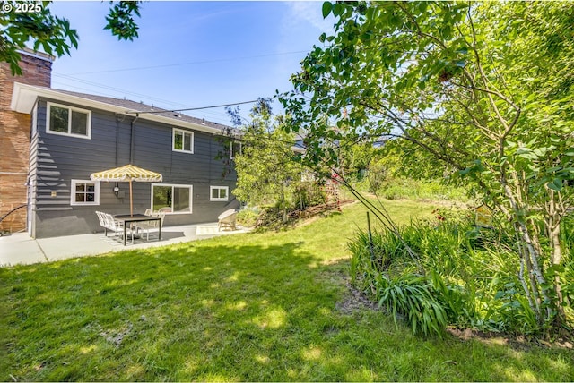 6220 SW 45th Ave, Portland, OR 97221 - view of grassy yard featuring a patio area