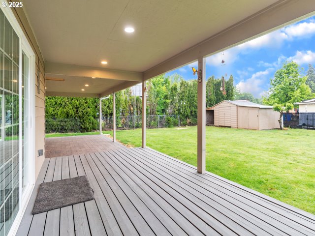 782 45th Ave, Salem, OR 97301 - wooden deck with a patio area, a storage unit, and an outbuilding