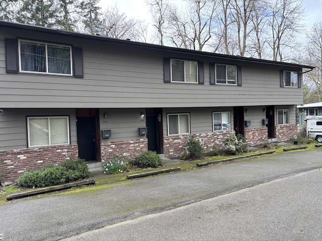 940 SW Caldew Dr, Portland, OR 97219 - view of property featuring brick siding