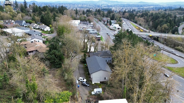 940 SW Caldew Dr, Portland, OR 97219 - aerial overview of property's location featuring a forest, nearby suburban area, and a major roadway