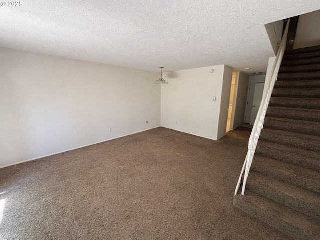 940 SW Caldew Dr, Portland, OR 97219 - carpeted spare room featuring stairs and a textured ceiling