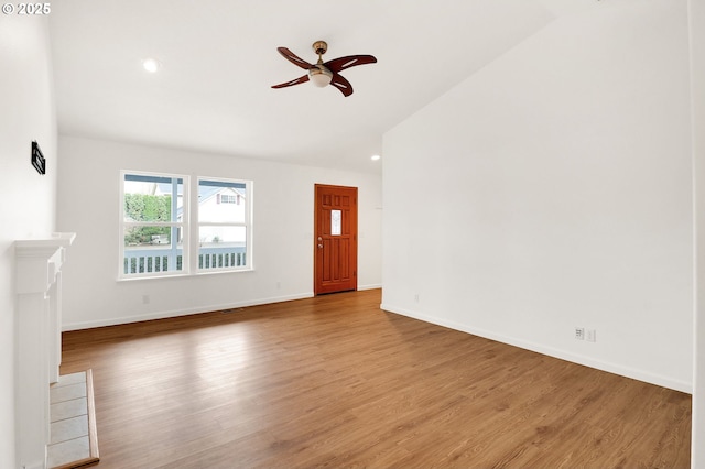 unfurnished living room with recessed lighting, baseboards, ceiling fan, and wood finished floors