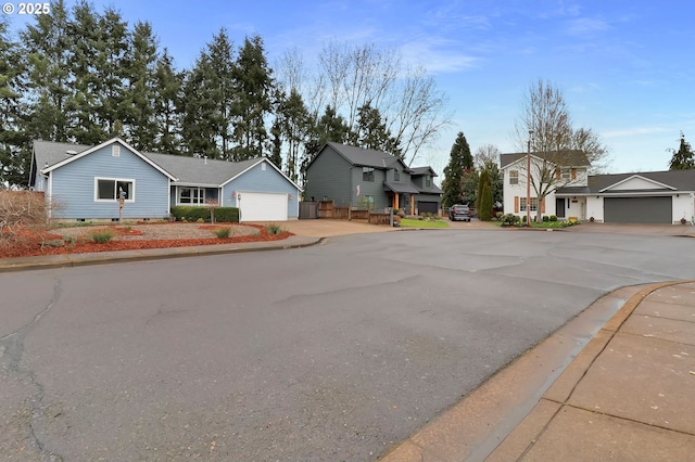 view of street featuring curbs, a residential view, and sidewalks