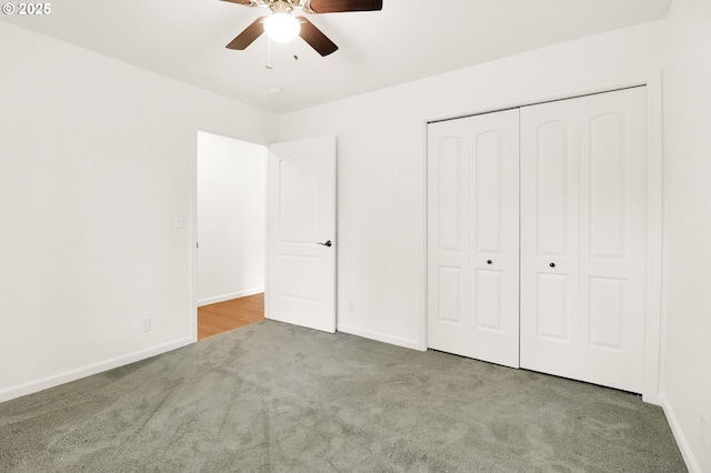 unfurnished bedroom with a closet, a ceiling fan, baseboards, and carpet floors