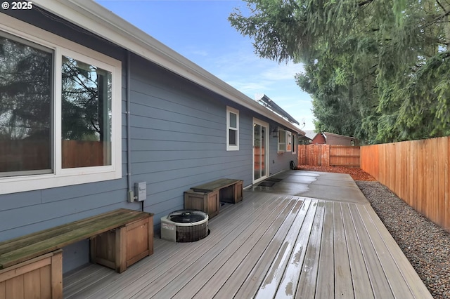 wooden terrace featuring a fenced backyard