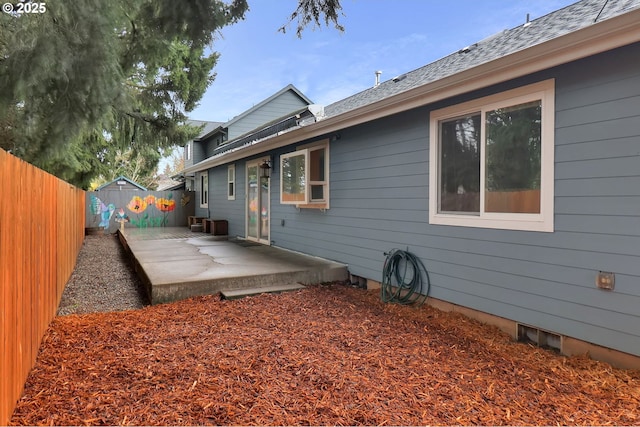 wooden deck with a patio and fence