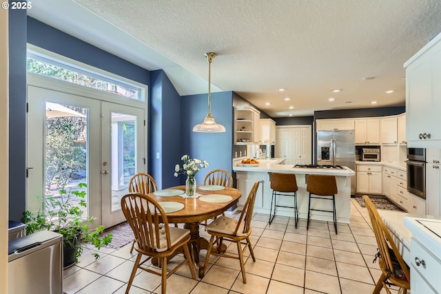 8650 SW Turquoise Loop, Beaverton, OR 97007 - dining room with light tile patterned flooring, a textured ceiling, and recessed lighting