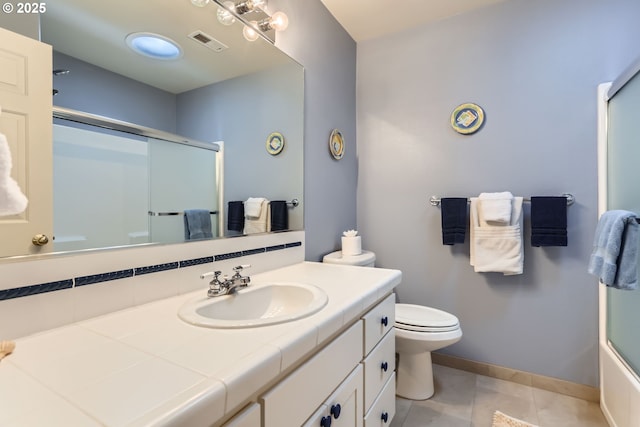 8650 SW Turquoise Loop, Beaverton, OR 97007 - full bath featuring a shower with shower door, vanity, toilet, baseboards, and tile patterned flooring