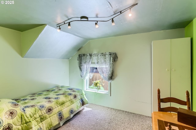 8650 SW Turquoise Loop, Beaverton, OR 97007 - carpeted bedroom featuring rail lighting and vaulted ceiling