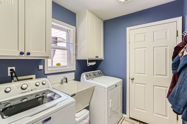 8650 SW Turquoise Loop, Beaverton, OR 97007 - laundry room with cabinet space and washer and clothes dryer