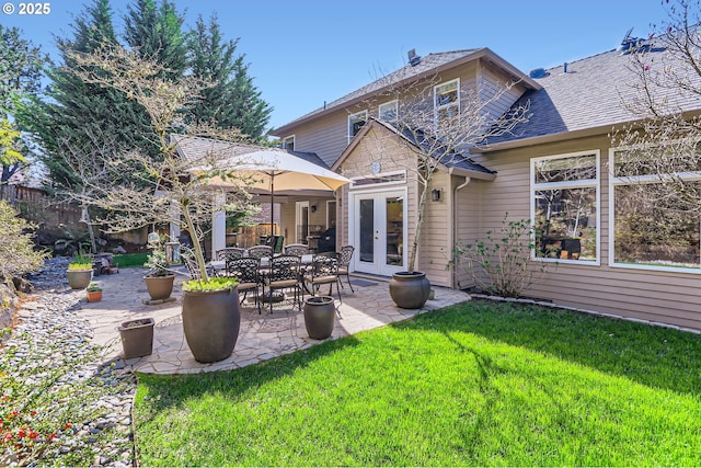 8650 SW Turquoise Loop, Beaverton, OR 97007 - back of house with french doors, a patio area, a yard, and roof with shingles