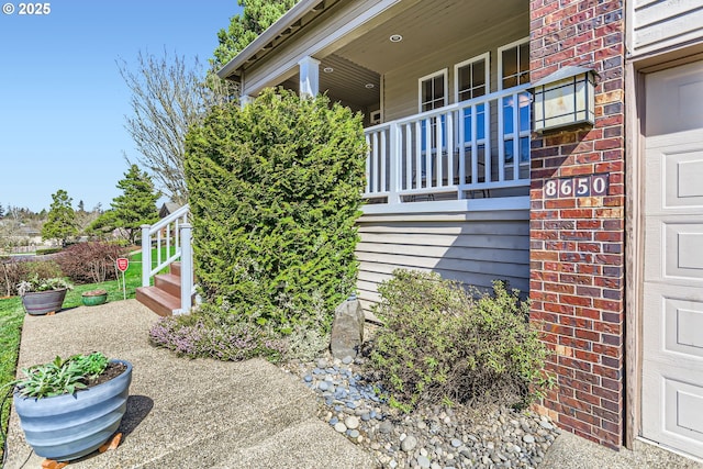 8650 SW Turquoise Loop, Beaverton, OR 97007 - view of side of home featuring brick siding and a garage