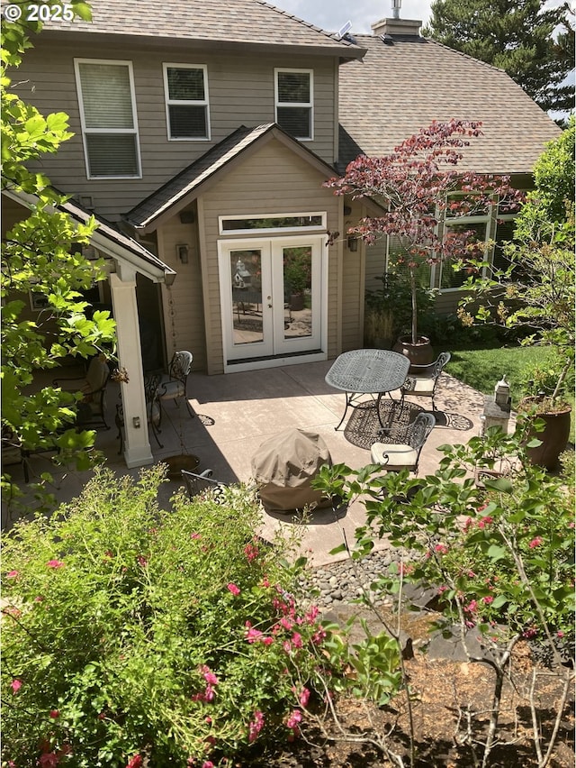 8650 SW Turquoise Loop, Beaverton, OR 97007 - back of property with a patio, french doors, a shingled roof, and a chimney