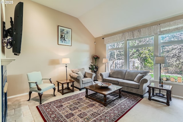 8650 SW Turquoise Loop, Beaverton, OR 97007 - living room with plenty of natural light, baseboards, lofted ceiling, and a fireplace