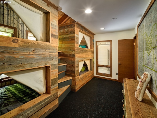 71183 Bracken Ln Unit Gh76, Black Butte Ranch, OR 97759 - hall with wooden walls, dark carpet, and recessed lighting