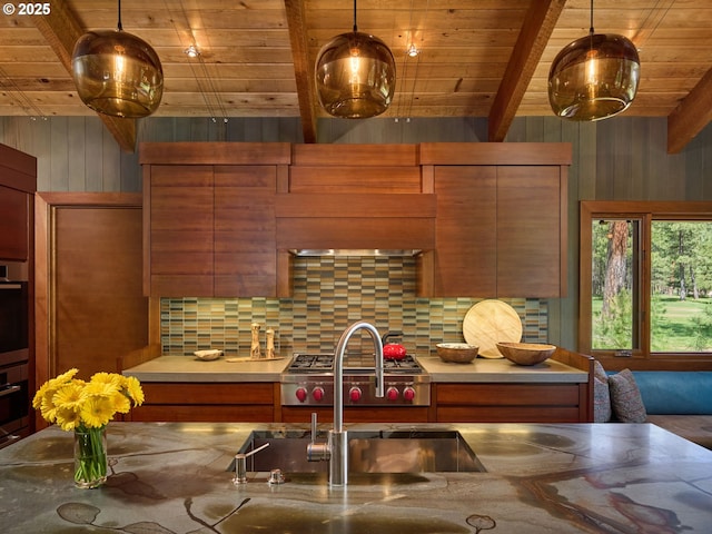 71183 Bracken Ln Unit Gh76, Black Butte Ranch, OR 97759 - kitchen featuring a wooden ceiling with exposed beams, backsplash, wood walls, brown cabinetry, and modern cabinets