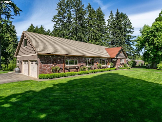 view of front of property featuring aphalt driveway, brick siding, a front lawn, and a tile roof