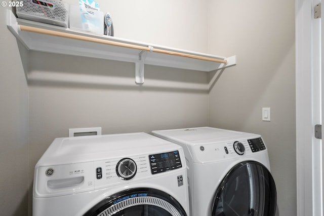 washroom featuring separate washer and dryer