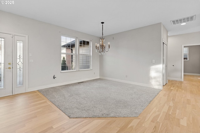 foyer featuring a notable chandelier and light wood-type flooring