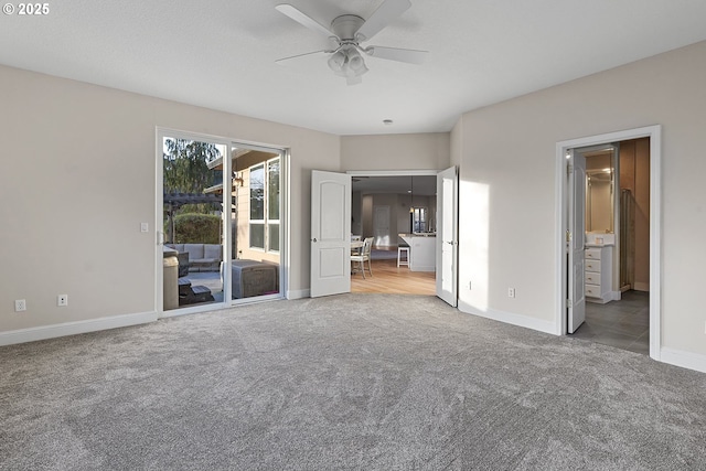 unfurnished bedroom featuring ensuite bath, access to outside, ceiling fan, and carpet