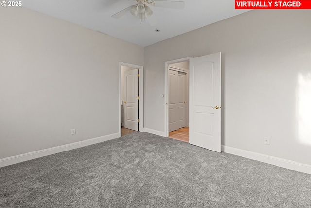 unfurnished bedroom featuring ceiling fan and light carpet