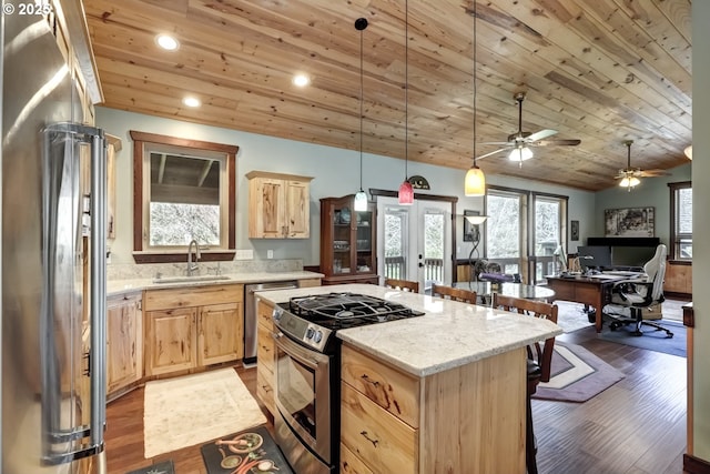 kitchen featuring stainless steel appliances, wooden ceiling, a sink, and light brown cabinetry