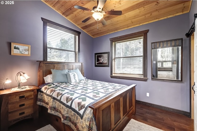 bedroom with wooden ceiling, dark wood-style floors, vaulted ceiling, baseboards, and ceiling fan