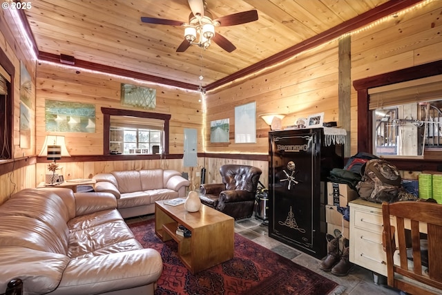 living room featuring wooden ceiling, wooden walls, and a ceiling fan