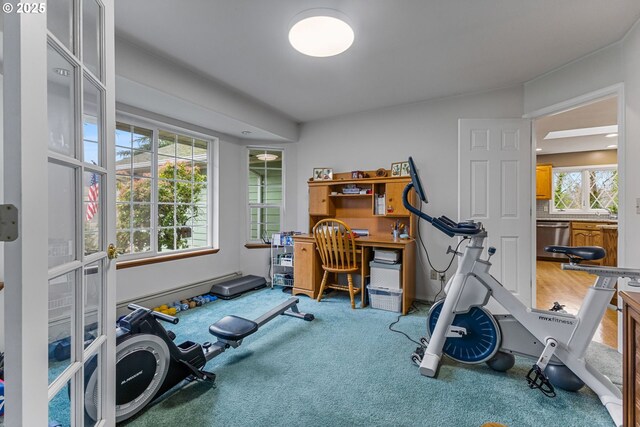 carpeted bedroom with a baseboard radiator