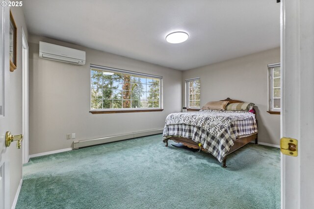 carpeted bedroom featuring ensuite bath, a wall mounted AC, and a baseboard radiator