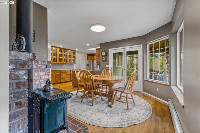 dining area featuring light hardwood / wood-style floors and french doors