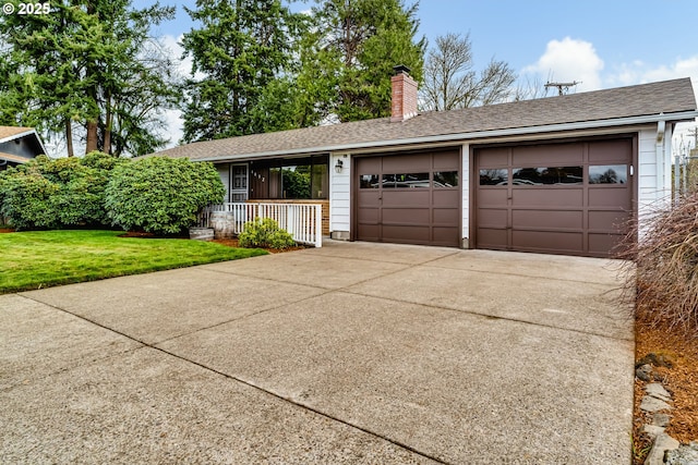 view of front of house with a shingled roof, a front lawn, concrete driveway, a chimney, and an attached garage