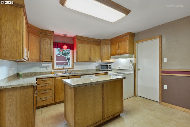 kitchen with sink, white appliances, a center island, light tile patterned flooring, and decorative light fixtures