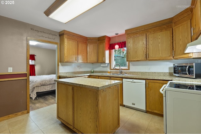 kitchen featuring sink, range, a center island, hanging light fixtures, and white dishwasher