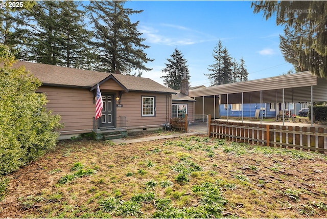 view of front of home with a carport