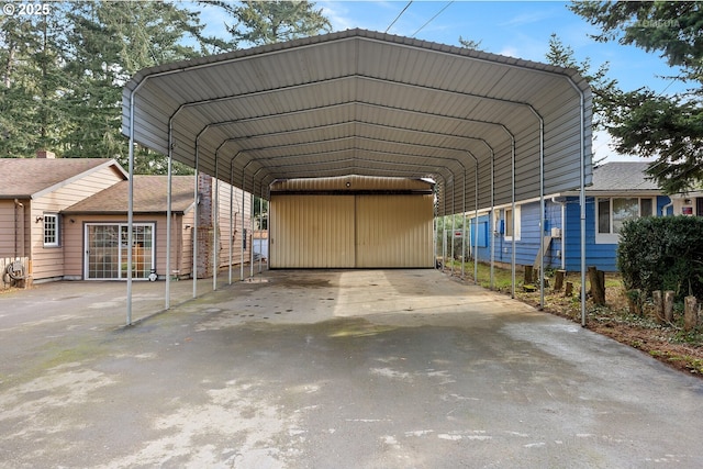 view of parking / parking lot with a carport