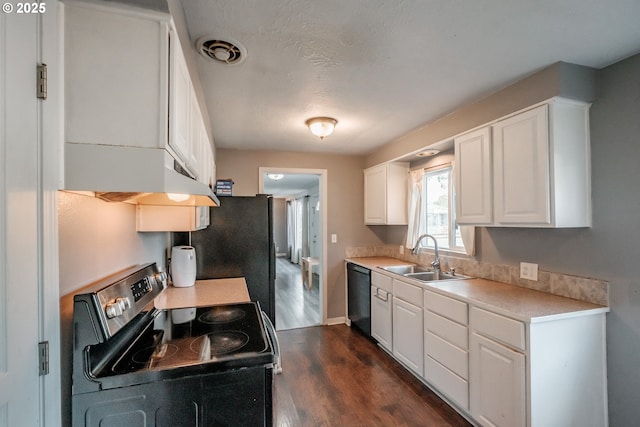 kitchen with white cabinetry, appliances with stainless steel finishes, dark wood-type flooring, and sink