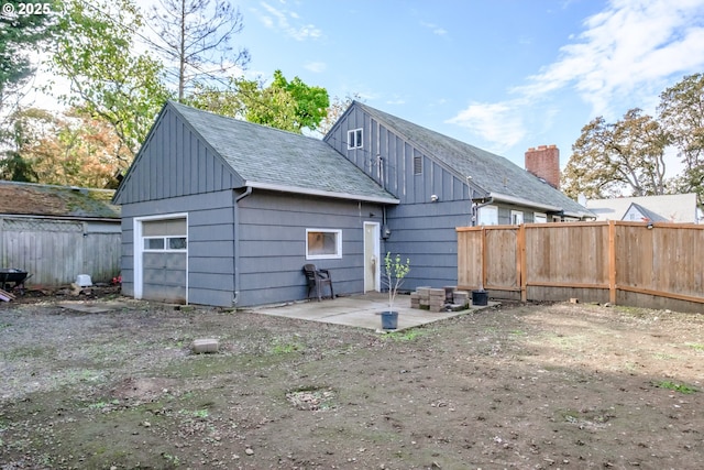 back of property with a patio