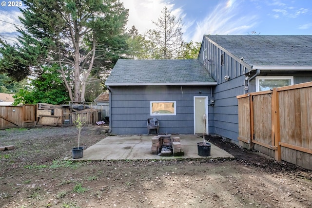 back of house with a patio