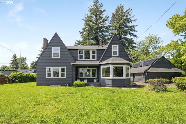 421 SE 141st Ave, Portland, OR 97233 - back of house featuring a chimney, a yard, and a shingled roof