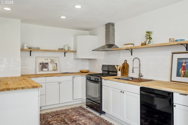 421 SE 141st Ave, Portland, OR 97233 - kitchen featuring open shelves, wooden counters, black appliances, wall chimney range hood, and a sink