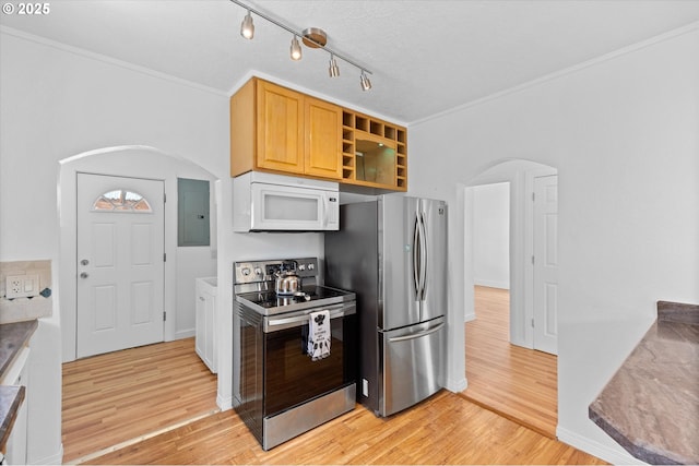 521 21st Ave, Longview, WA 98632 - kitchen with appliances with stainless steel finishes, arched walkways, electric panel, light wood finished floors, and crown molding