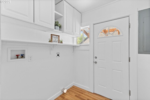 521 21st Ave, Longview, WA 98632 - laundry room featuring electric dryer hookup, cabinet space, electric panel, hookup for a washing machine, and light wood-style floors