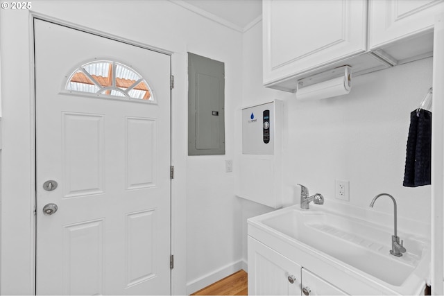 521 21st Ave, Longview, WA 98632 - bathroom with electric panel, vanity, wood finished floors, baseboards, and ornamental molding